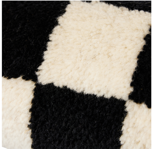Woolen bolster cushion black and white statement